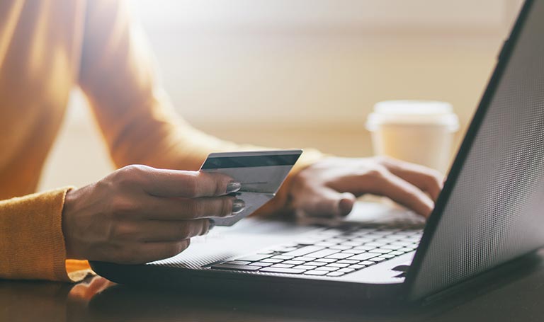 Woman making a credit card payment online