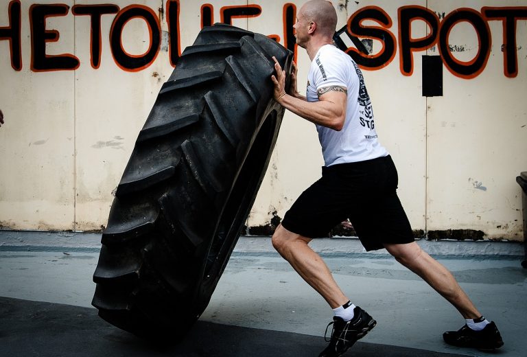 Crossfit man flipping a tire