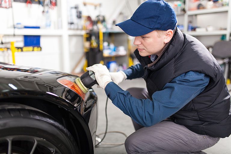 Man buffing a car